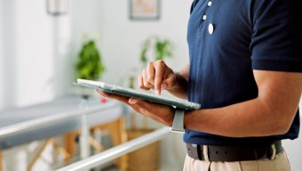 Physiotherapy,,Tablet,And,Hands,With,Man,And,Scroll,For,Treatment